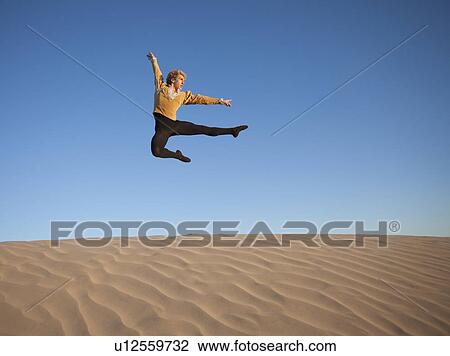 Ballet dancer in desert View Large Photo Image Stock Image - Ballet dancer in desert. Fotosearch