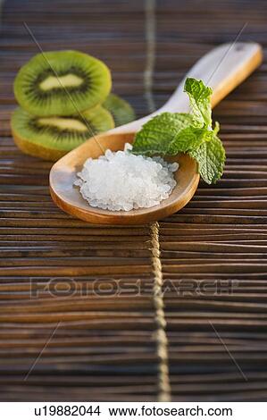 Picture - Bath salt on wooden spoon. Fotosearch
