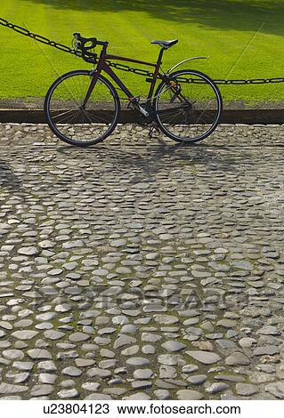Bicycle on cobblestone path View Large Photo Image Stock Image - Bicycle on cobblestone path. Fotosearch