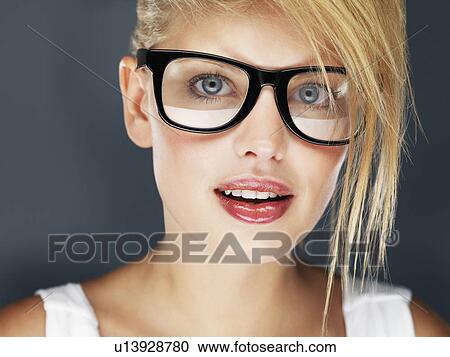 Blond woman wearing glasses and glossy lipstick View Large Photo Image Stock Image - Blond woman wearing glasses and glossy lipstick. Fotosearch