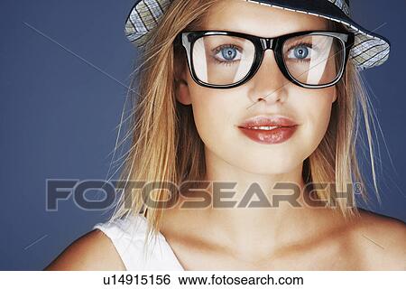 Stock Photograph - Blond woman wearing sunglasses and sunhat. Fotosearch