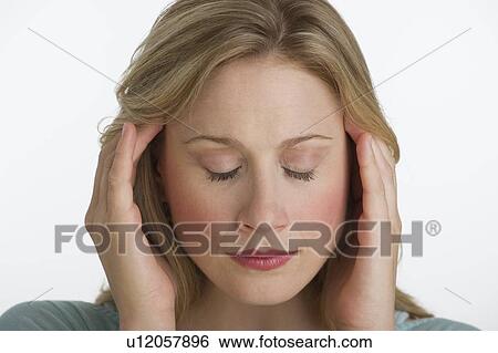 Blond woman with a headache View Large Photo Image Stock Photograph - Blond woman with a headache. Fotosearch