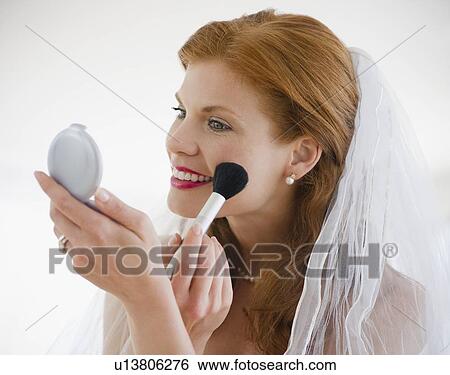 Bride putting on blush View Large Photo Image Stock Photograph - Bride putting on blush. Fotosearch