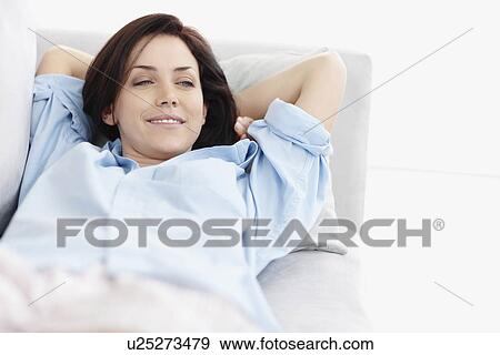 Stock Photo - Brunette woman resting. Fotosearch