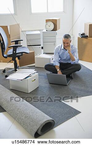 Picture - Business entrepreneur working in startup office. Fotosearch