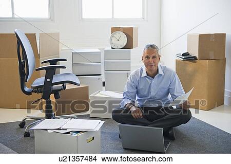 Business entrepreneur working in startup office View Large Photo Image Picture - Business entrepreneur working in startup office. Fotosearch