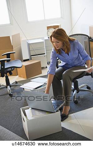 Business entrepreneur working in startup office View Large Photo Image Stock Image - Business entrepreneur working in startup office. Fotosearch