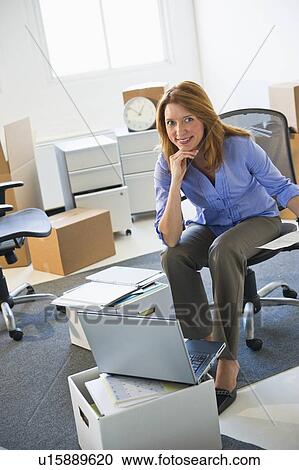Stock Image - Business entrepreneur working in startup office. Fotosearch