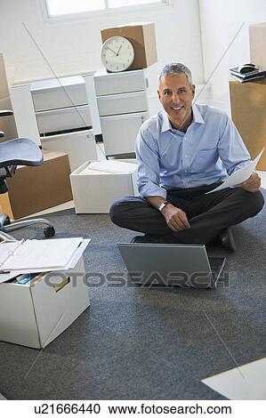 Stock Image - Business entrepreneur working in startup office. Fotosearch