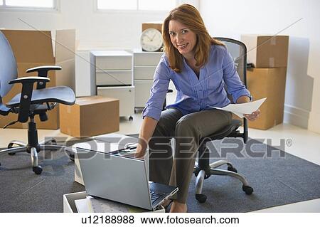 Business entrepreneur working in startup office View Large Photo Image Stock Photo - Business entrepreneur working in startup office. Fotosearch