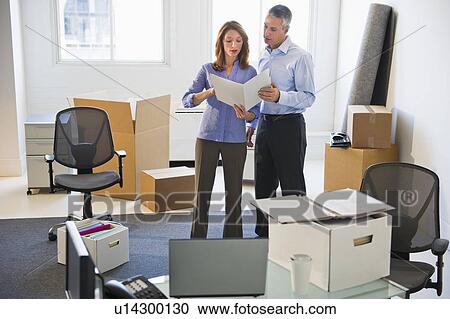 Business entrepreneurs working in startup office View Large Photo Image Stock Image - Business entrepreneurs working in startup office. Fotosearch
