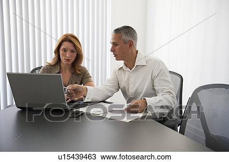 Stock Image - Business people in conference room. Fotosearch