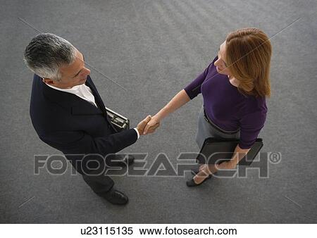 Stock Photography - Business people shaking hands. Fotosearch