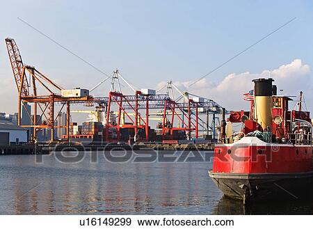 Stock Photo - Cargo ships and container crane. Fotosearch