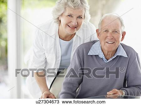 Stock Image - Cheerful senior couple. Fotosearch