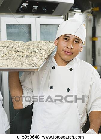 Chef holding tray of bread View Large Photo Image Stock Photo - Chef holding tray of bread. Fotosearch