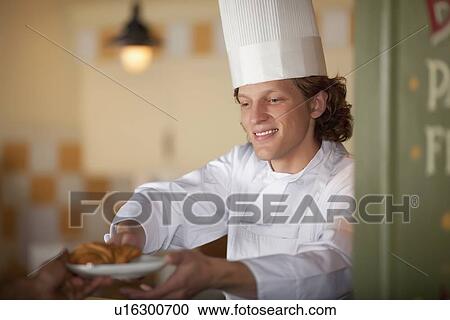 Chef serving pastry View Large Photo Image Stock Image - Chef serving pastry. Fotosearch