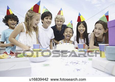 Children at a birthday celebration View Large Photo Image Stock Image - Children at a birthday celebration. Fotosearch