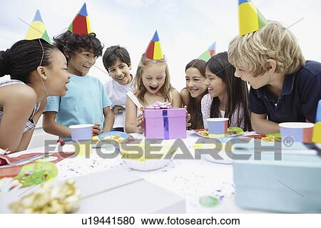 Children at a birthday celebration View Large Photo Image Stock Image - Children at a birthday celebration. Fotosearch