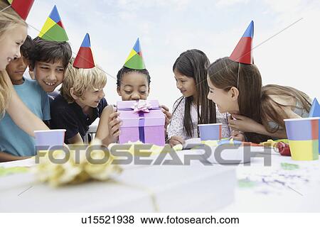Children at a birthday celebration View Large Photo Image Stock Photo - Children at a birthday celebration. Fotosearch