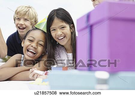 Children at a birthday celebration View Large Photo Image Stock Photo - Children at a birthday celebration. Fotosearch
