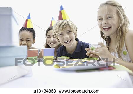 Stock Image - Children at a birthday party. Fotosearch