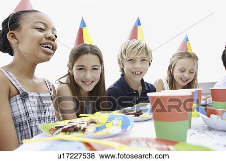 Children at a birthday party View Large Photo Image Stock Photo - Children at a birthday party. Fotosearch