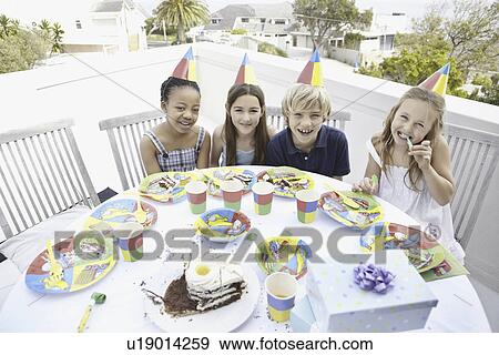 Stock Photo - Children at a birthday party. Fotosearch