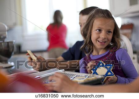 Stock Image - Children baking cookies. Fotosearch