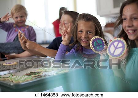 Stock Photo - Children baking cookies. Fotosearch