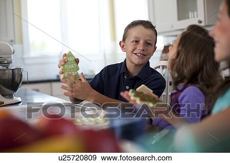 Stock Photo - Children baking cookies. Fotosearch