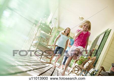 Children running on porch View Large Photo Image Stock Image - Children running on porch. Fotosearch