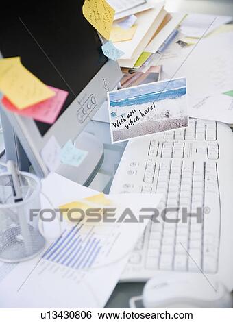 Stock Photograph - Cluttered desk. Fotosearch