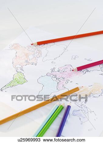 Stock Image - Colored pencils and map of world. Fotosearch