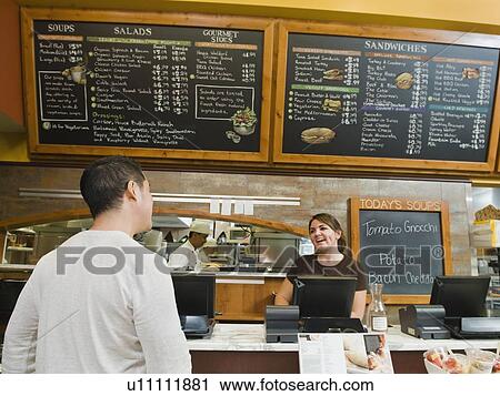 Customer ordering food at bakery View Large Photo Image Stock Image - Customer ordering food at bakery. Fotosearch