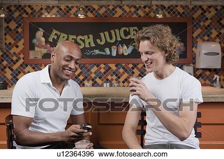 Stock Photograph - Customers in juice bar. Fotosearch