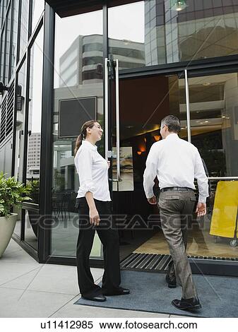 Stock Photography - Customers walking into building. Fotosearch