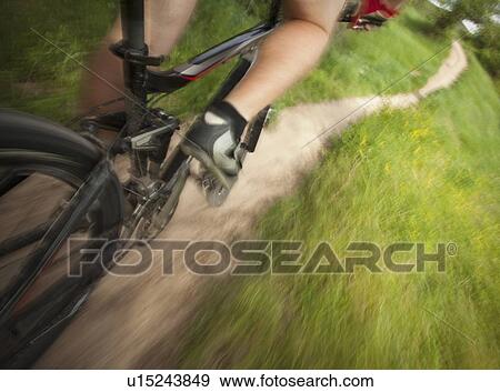 Cyclist on single track trail View Large Photo Image Stock Photo - Cyclist on single track trail. Fotosearch