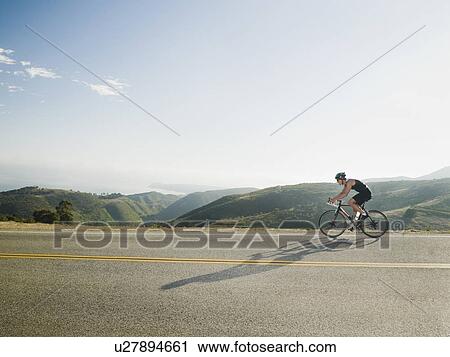 Cyclist road riding in Malibu View Large Photo Image Stock Image - Cyclist road riding in Malibu. Fotosearch