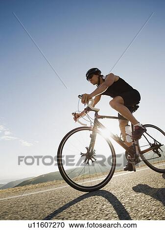Stock Image - Cyclist road riding. Fotosearch