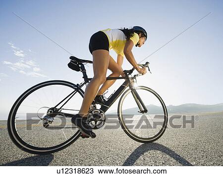 Stock Image - Cyclist road riding. Fotosearch