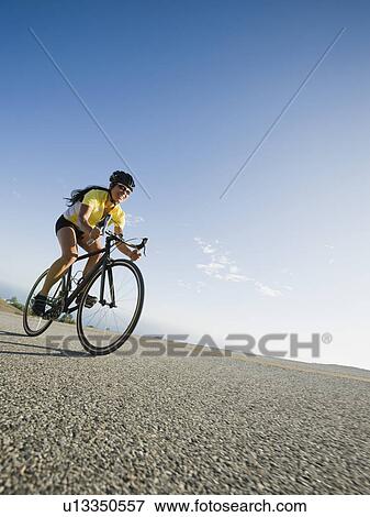 Cyclist road riding View Large Photo Image Stock Photo - Cyclist road riding. Fotosearch