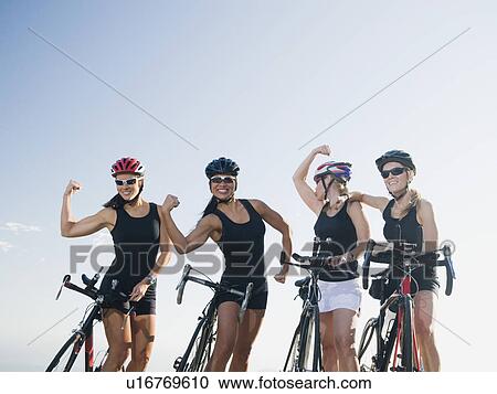 Stock Image - Cyclists flexing their biceps. Fotosearch