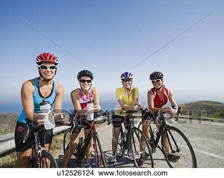 Picture - Cyclists stopping for a water break. Fotosearch