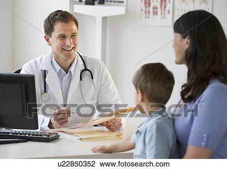 Doctor talking to woman and her son View Large Photo Image Stock Image - Doctor talking to woman and her son. Fotosearch
