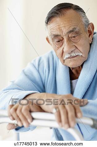 Elderly patient leaning on a walker View Large Photo Image Stock Image - Elderly patient leaning on a walker. Fotosearch