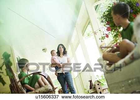 Stock Photo - Family on porch. Fotosearch