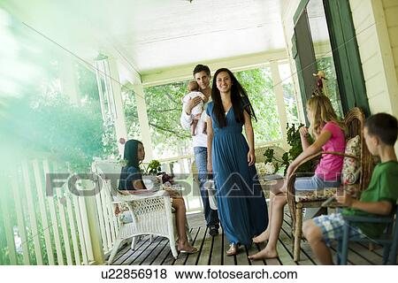 Family on porch View Large Photo Image Stock Photo - Family on porch. Fotosearch