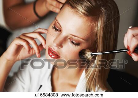 Stock Photo - Fashion model being styled. Fotosearch