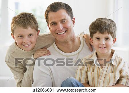 Stock Image - Father and his two sons. Fotosearch
